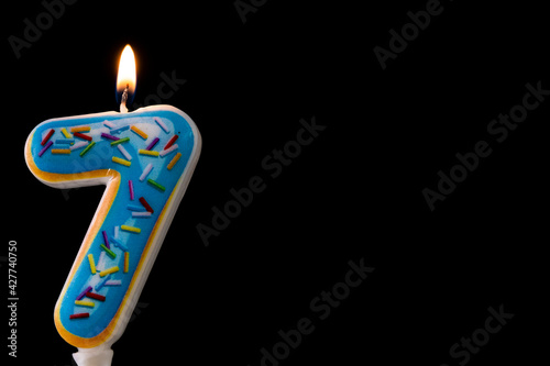 Birthday candles isolated on the black background. Copy space for text