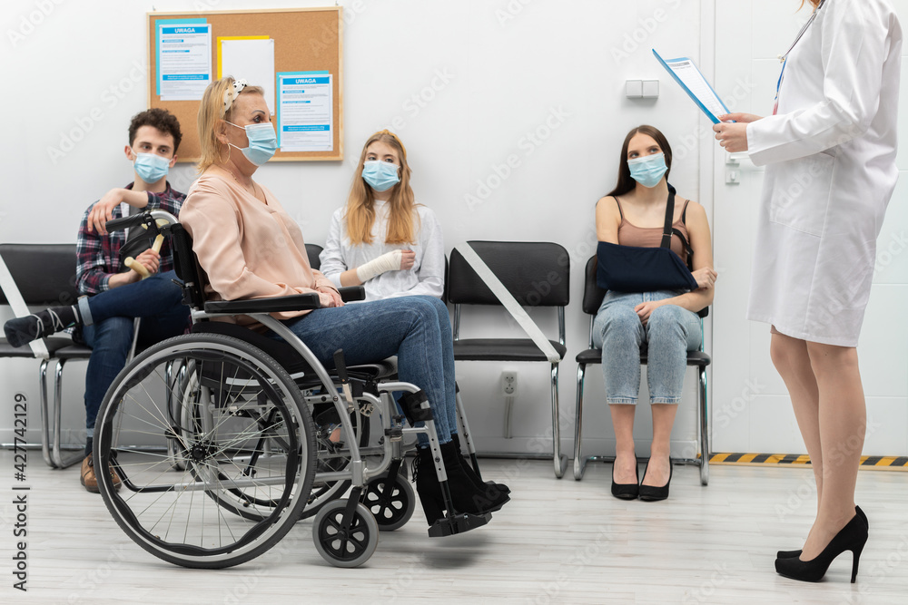 The doctor reads out the next person from the queue and invites you to join her in the doctor's office. A protective mask over the mouth and nose The doctor reads out the next person from the queue and invites you to join her in the doctor's office. A protective mask over the mouth and nose