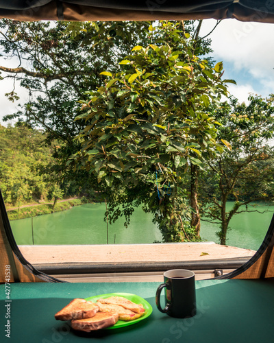 Breakfast in a camping tent overlooking the lake