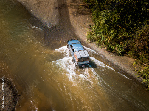 Aerial view of car crossing a river