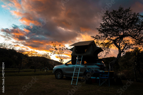 Sunset on the mountains camping in vehicle