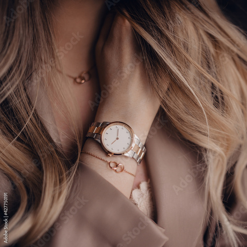Beautiful white golden watch on woman hand