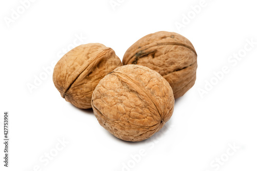 walnut in a group of three isolated on a white background close-up macro. Healthy food. Having a snack