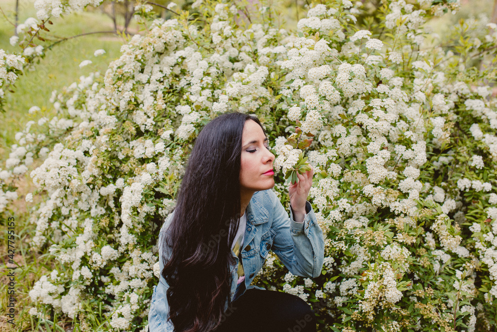girl feeling nature smelling flowers girl feeling nature smelling flowers