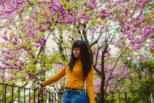 girl feeling nature smelling flowers 