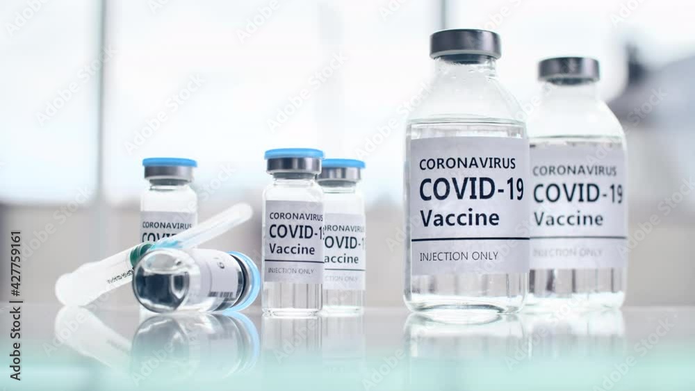 Close-up of liquid for injections and syringes. Test tubes with the coronavirus treatment vaccine. High quality 4k footage Close-up of liquid for injections and syringes. Test tubes with the coronavirus treatment vaccine. High quality 4k footage