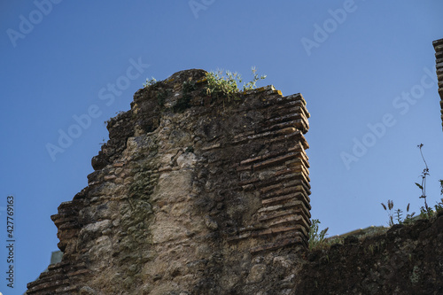 Closeup shot of ruins under a clear blue sky photo