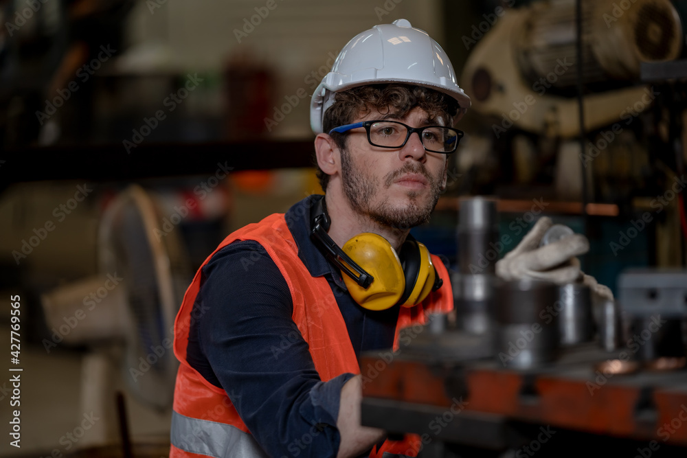 Technician workers are turning iron,Engineer control operating lathe grinding machine working in industry factory. Technician workers are turning iron,Engineer control operating lathe grinding machine working in industry factory.