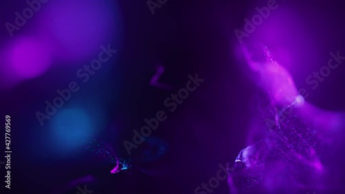 Abstract Macro slow motion shot of Blue and Orange Particle Fluid isolated on black. paint drops mixing in water. Ink swirling underwater. Colored cloud abstract smoke explosion animation. 3D render