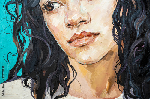 Fragment of work where fiery black curly hair as a waterfall falls from the head of a white-faced girl. .Portrait of a Hispanic woman on a blue background. Oil painting on canvas.