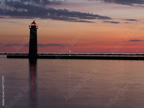 Multicolored sunset behind Muskegon Michigan lighthouse