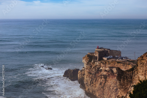View of the cliff and lighthouse in Nazaré