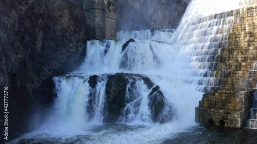 Waterfall of New Croton dam in Westchester County, New York. Aerial ascending tilt-up photo