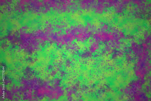 An abstract paint splatter background image. © jdwfoto