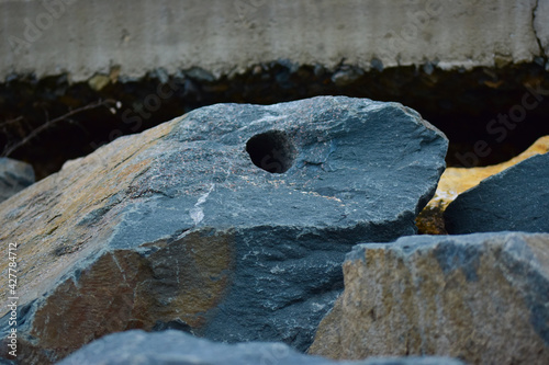 Canvas Print Closeup shot of a hole on the stone