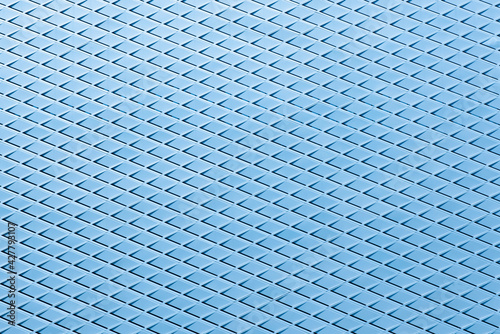 Metal mesh texture with blue background