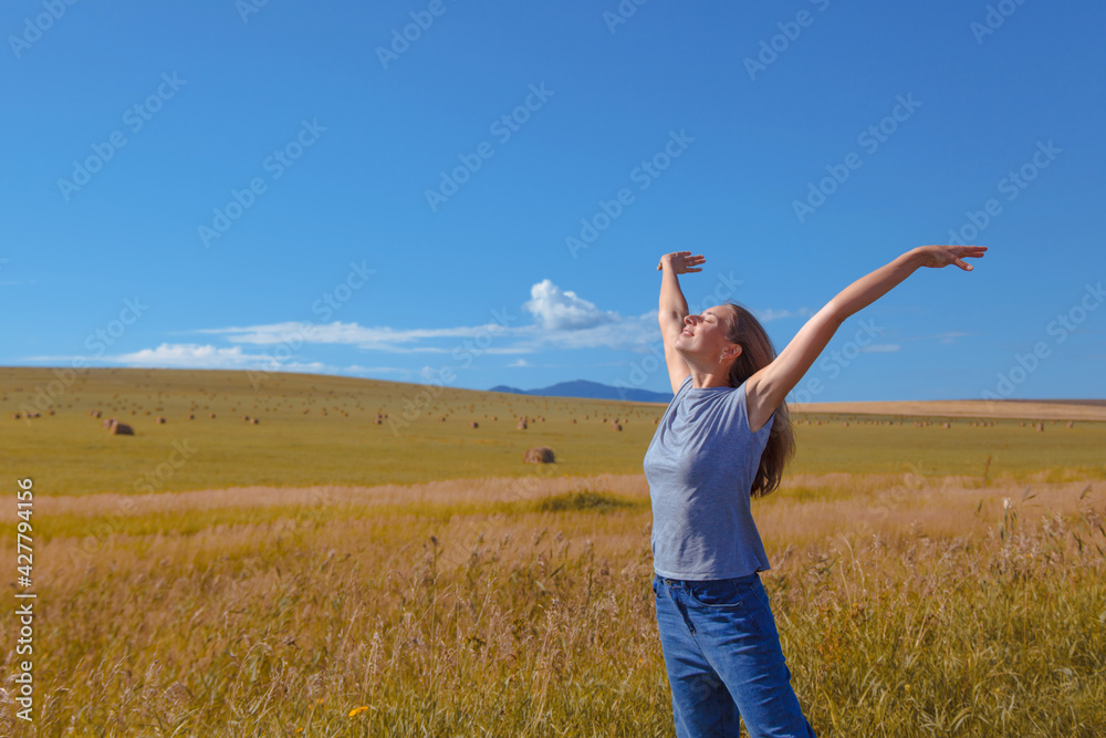 Harvest: ripe wheat grows in the field. Golden grain and hand close-up