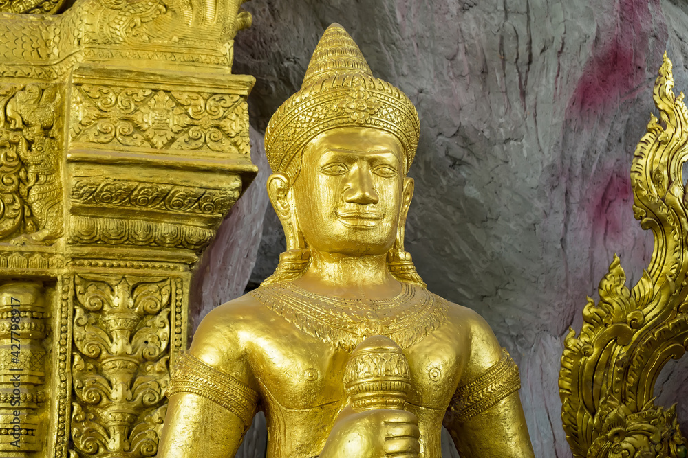 Golden statue of khmer art in thai temple