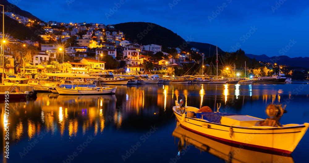 Obraz premium Kas Harbour at night as viewed from the sea, Lycian Coast, Turkey