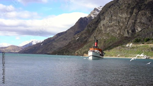 Queenstown, New Zealand - August 2019. The TSS Earnslaw is a 1912 Edwardian vintage twin screw steamer plying the waters of Lake Wakatipu in New Zealand.  