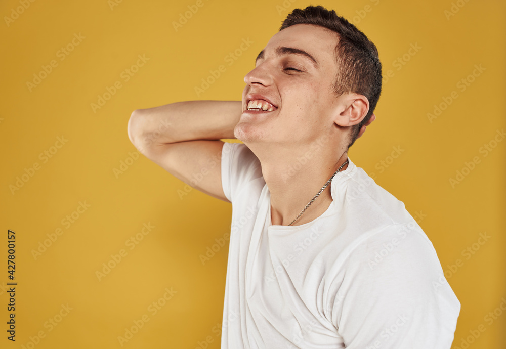 Joyful man gesturing with his hands on yellow background cropped view Joyful man gesturing with his hands on yellow background cropped view