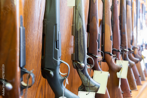 Fotografie, Obraz Gun store interior with specialized rifles on showcase