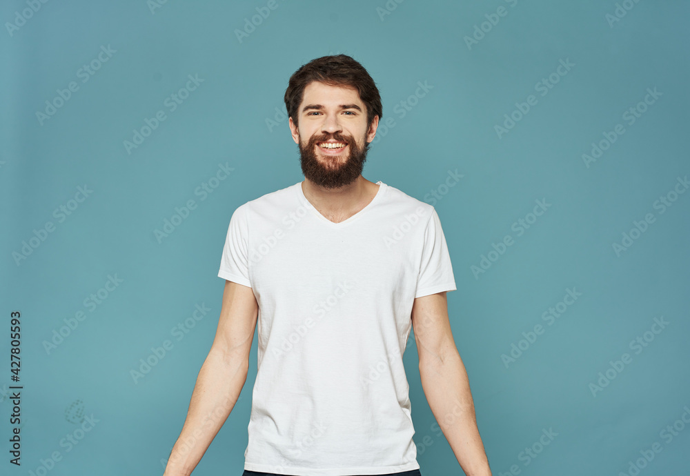 man in a white t-shirt on a blue background fast beard mustache Model