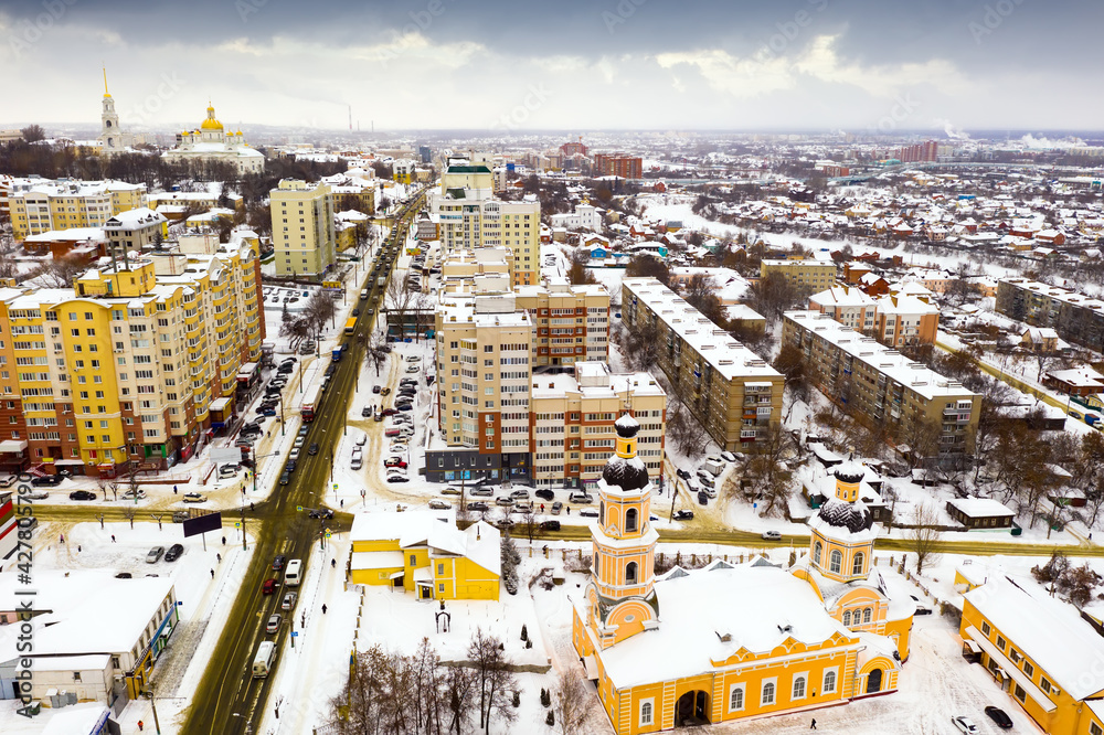 Obraz premium Scenic view from drone of snow covered modern Penza cityscape with two domed Orthodox Cathedral of Intercession, Russia..