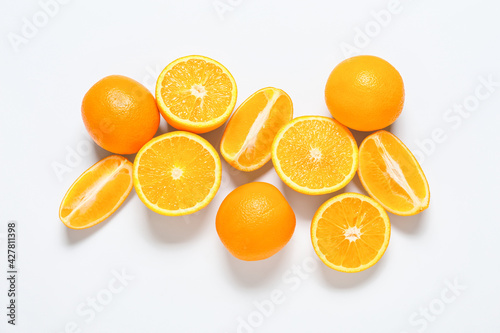 Fresh cut oranges on white background