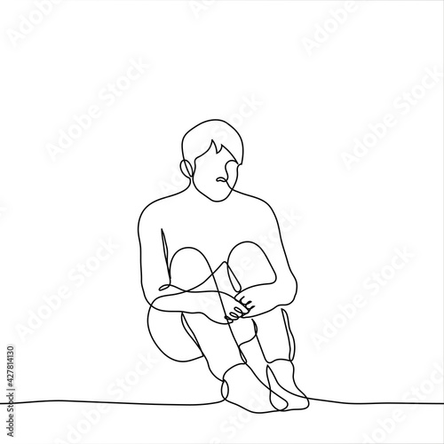 sad lonely man sitting on the floor hugging his knees - one line drawing. the concept of loneliness, outsider, isolation, depression, abandonment