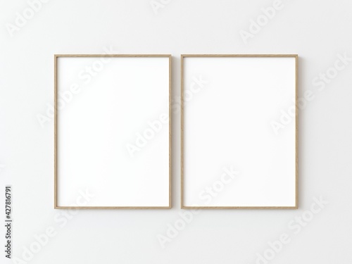 Two light wood thin rectangular vertical frame hanging on a white textured wall mockup, Flat lay, top view, 3D illustration