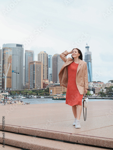 Photography Woman in a red dress walks the streets of Australia