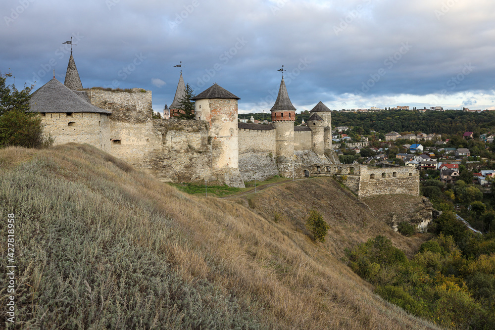 Beautiful view of the old fortress against the background of the modern city