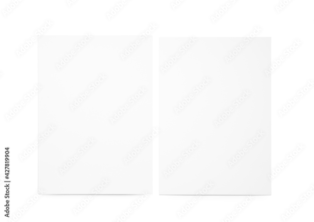 Blank sheets of paper on light background