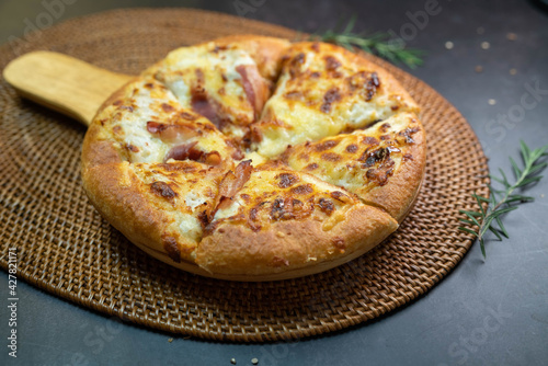 Delicious fresh pizza served on wooden plate, Hot Homemade Pizza Ready to serve.