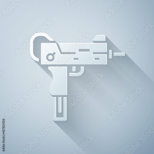 Paper cut UZI submachine gun icon isolated on grey background. Automatic weapon. Paper art style. Vector