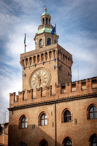 Torre degli Accursi and Palazzo Accursio. Clock tower and City hall in downtown of Bologna (XIII century), Piazza Maggiore, Emilia-Romagna, Italy, Europe. 