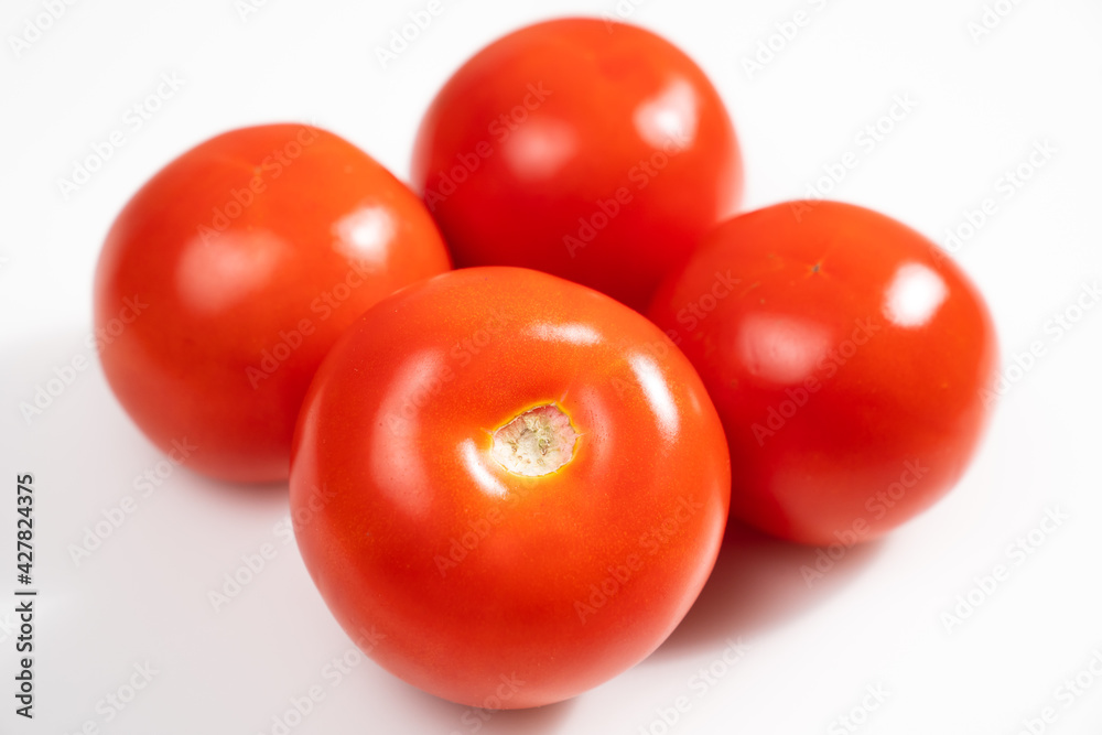 tomatoes on a white background. vegetable harvest. eco-friendly farm products. tomatoes on a white background. vegetable harvest. eco-friendly farm products.