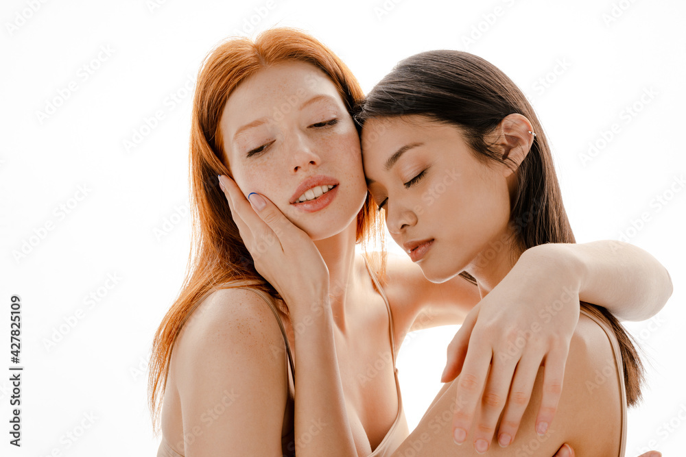Close up studio portrait of two beautiful young girls