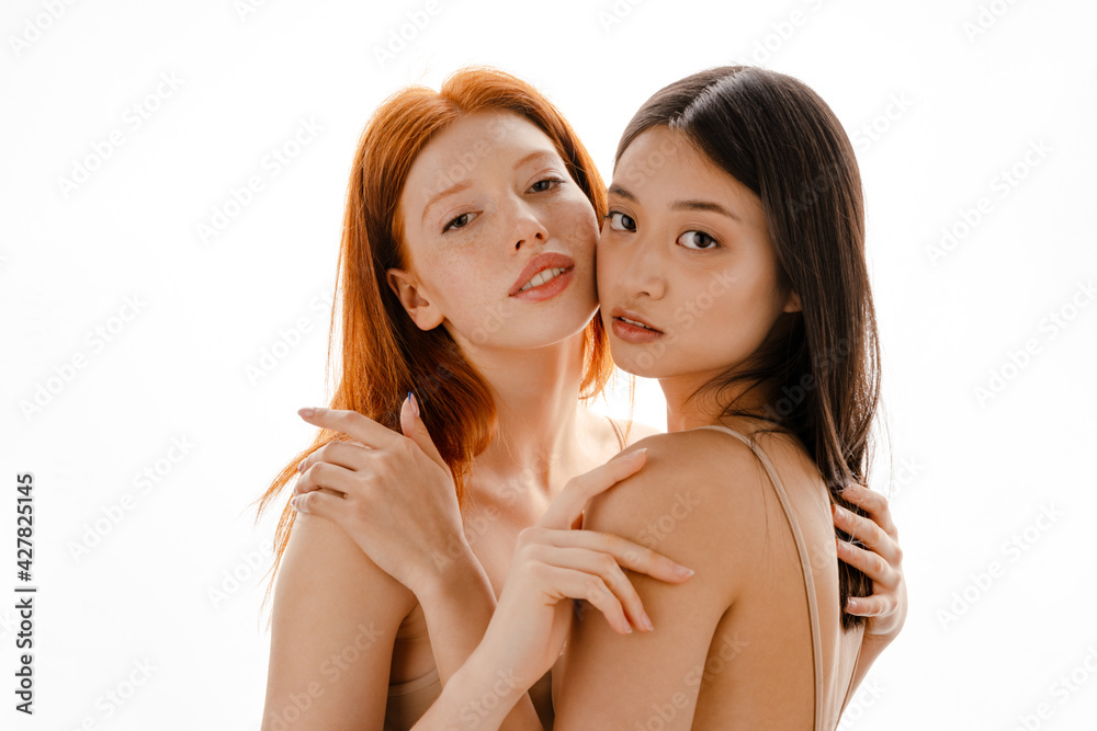 Close up studio portrait of two beautiful young girls Close up studio portrait of two beautiful young girls