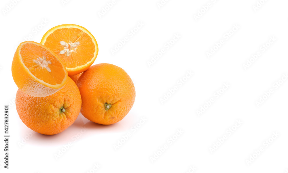 juicy orange fruits are whole and cut in half, isolated on a white background. juicy orange fruits are whole and cut in half, isolated on a white background.