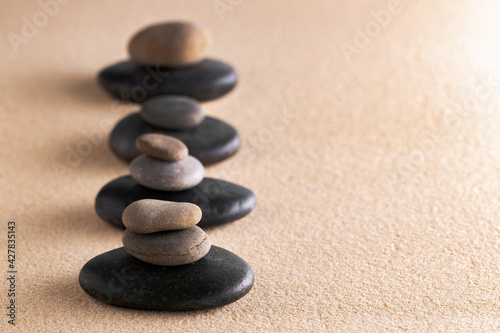 Japanese zen garden meditation stone in sand