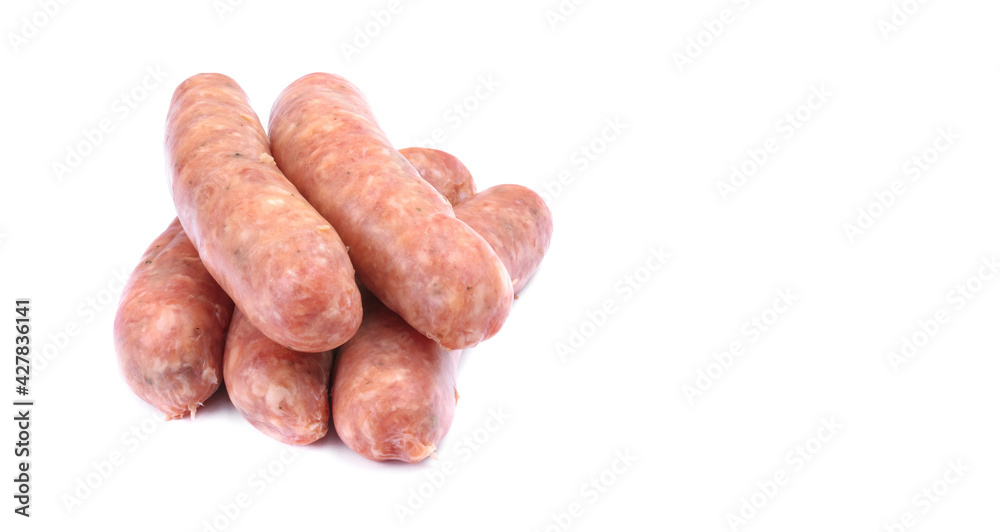 Raw pork sausages.Grilled sausages in close-up, isolated on a white background.Selective focus. Raw pork sausages.Grilled sausages in close-up, isolated on a white background.Selective focus.
