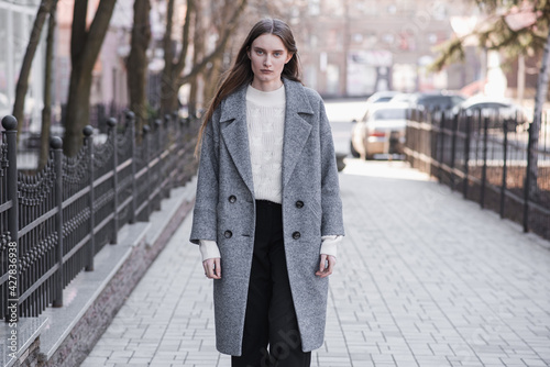 Portrait of an attractive girl on the street while walking