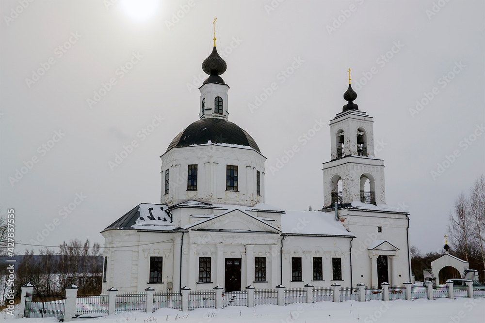 orthodox church made of white brick in winter