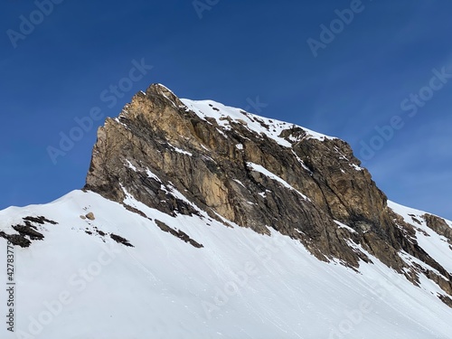 Snowy alpine mountain peak Oldenhorn (Oldehore or Becca d'Audon) located in a mountain massif Les Diablerets (Rochers or Scex de Champ) - Canton of Vaud, Switzerland (Suisse) / Glacier 3000 photo