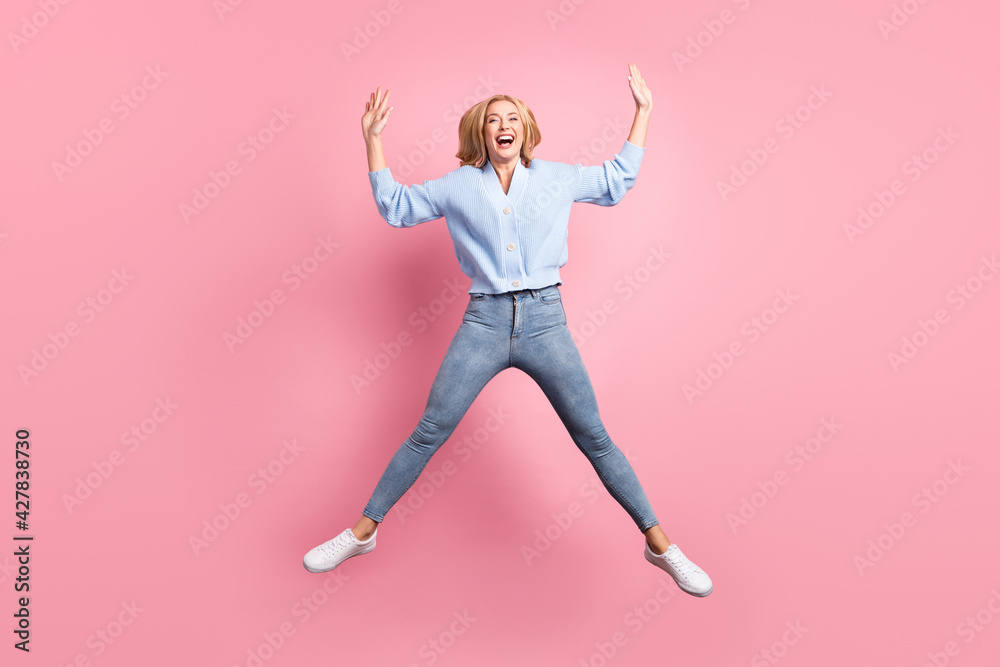 Full size photo of young funky funny smiling positive cheerful girl jumping laughing isolated on pink color background
