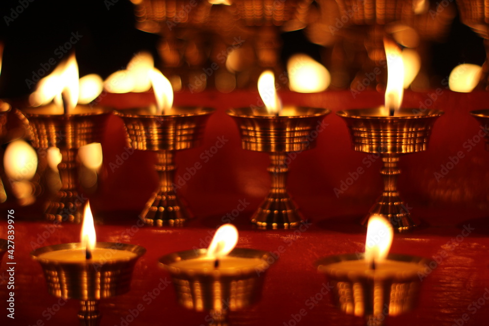 Buddhist Altar Candles at Religious 108 Butter Lamp Festival in Temple Monastery. Beautiful Tranquil Scenic View of Oil Lamps and Swaying Flame for Praying Buddhist Altar Candles at Religious 108 Butter Lamp Festival in Temple Monastery. Beautiful Tranquil Scenic View of Oil Lamps and Swaying Flame for Praying