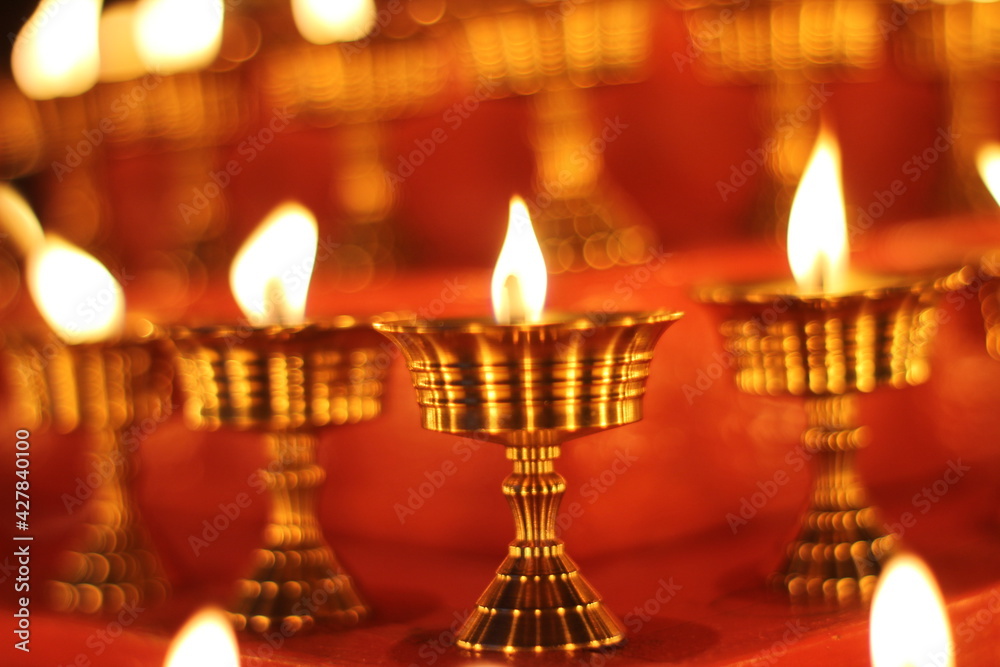 Buddhist Altar Candles at Religious 108 Butter Lamp Festival in Temple Monastery. Beautiful Tranquil Scenic View of Oil Lamps and Swaying Flame for Praying