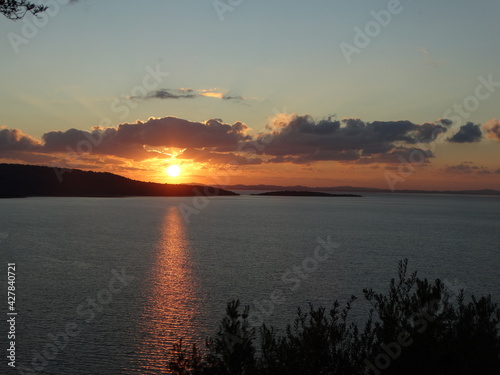 Tropical Sunset With Fire Red Yellow Orange Colors And Cloudy Sky